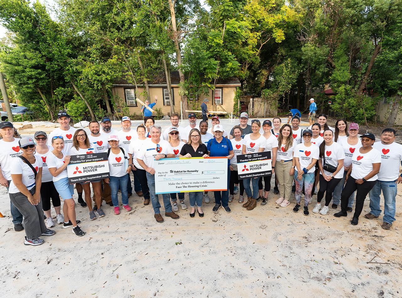 Mitsubishi Power team giving the check to Habitat for Humanity 2024