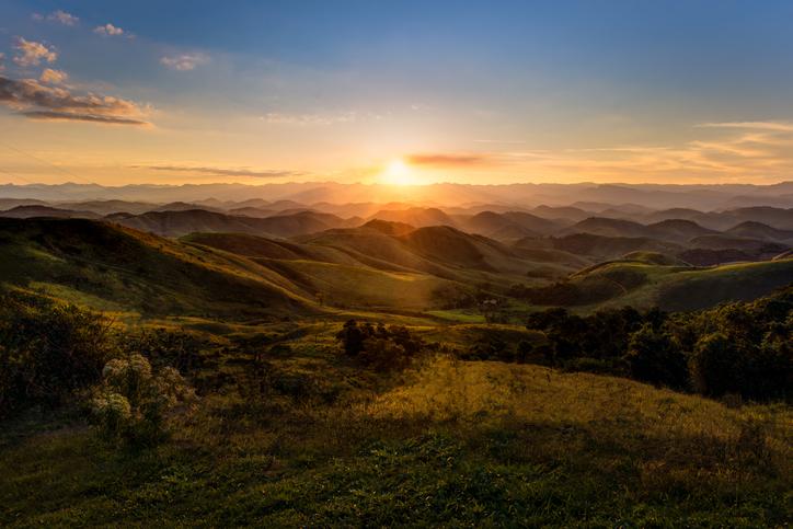 Grassy mountains with sunlight shining through