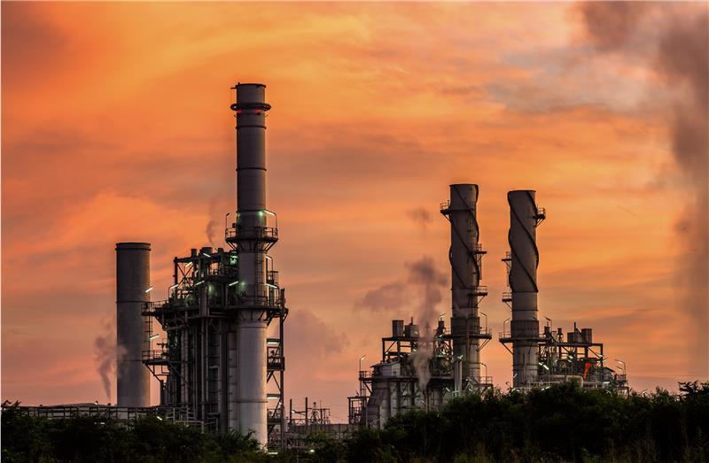 Power plant with orange sky behind
